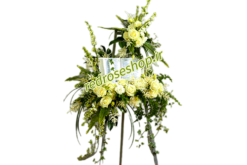 تاج-گل-تبریک-پایه دار-گلهای-سفید-رز-شبو-مریم-برگهای-سبز-تزیینی-پهن-و-ریز